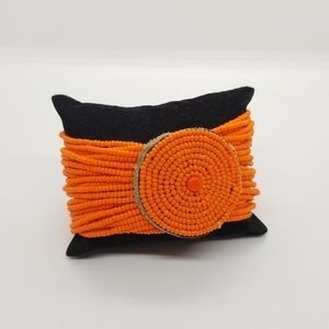 orange seed bead wide bracelet with circle detail